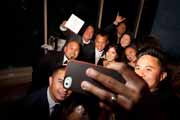 Wedding reception group selfie with newlyweds.