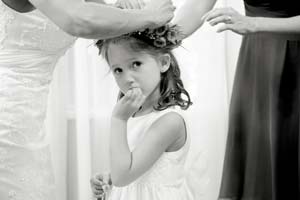 A wedding flower girl gets her hair done.